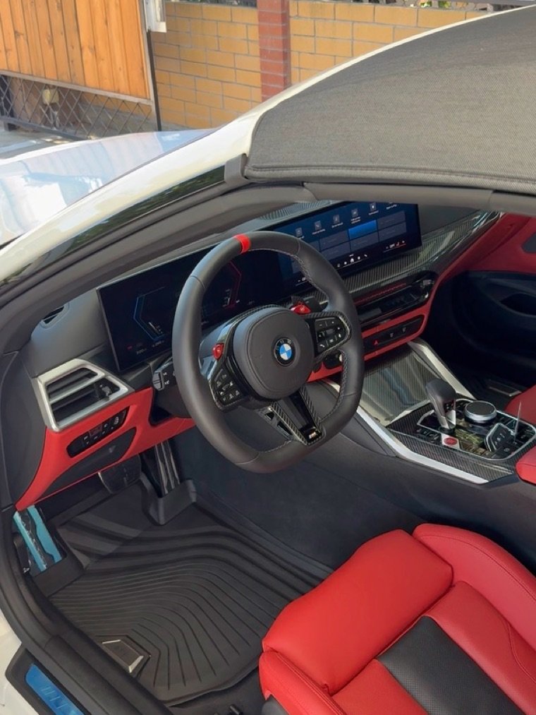 BMW M4 interior with red leather after a full interior detail