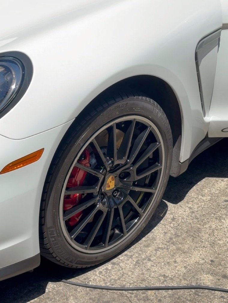 Porsche Panamera GTS wheel cleaned to a gloss black finish